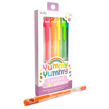 A set of 6 neon gel pens in a box with a cut out window and the heading 'Yummy Yummy 6 scented neon gel pens. There is one pen laying in front of the box.