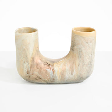 A resin vase with a U shape in light brown.