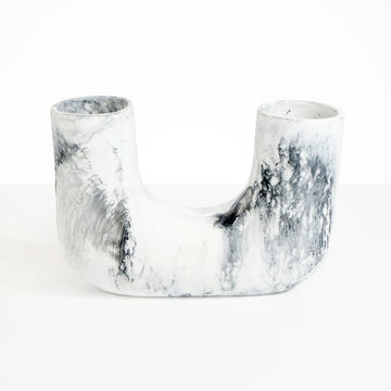 A resin vase with a U shape in white marble.