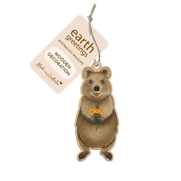 Wooden quokka decoration with a tag labeled 'Earth Greetings' on a white background.