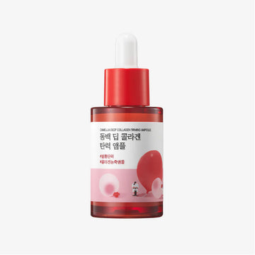 Skincare serum bottle with red cap and pink label on a white background.