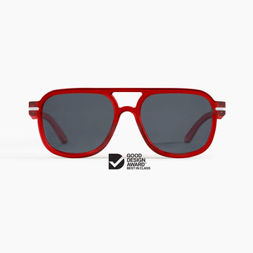 Red sunglasses with dark lenses on a white background, featuring a Good Design Award logo.