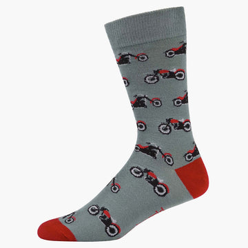 A grey sock with a red heel and toe and illustrated with motorbikes.