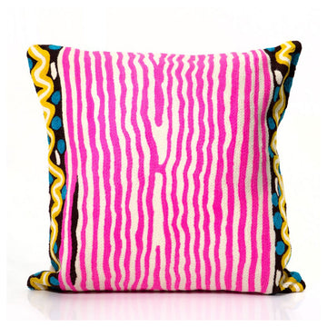A square cushion embroidered with pink vertical stripes and yellow and blue edging on the left and right side.