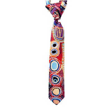 A tie is hanging down and printed with artwork by Murdie Morris.