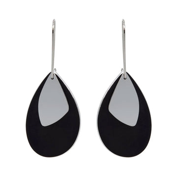 A pair of drop earrings made from stainless steel with a tear drop shaped black piece and a smaller silver piece over the top.