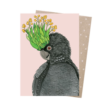 Card with a black cockatoo illustration holding flowers on it's crest on a pink background.