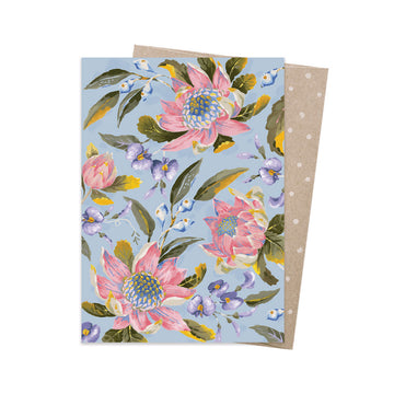 Floral card with pink flowers on a blue background.