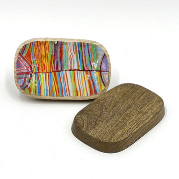 A wooden tray showing a colourful pattern printed on the inside and a plain wooden back.