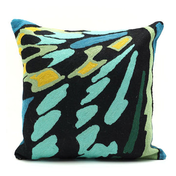 Decorative pillow with a colorful abstract pattern on a white background.