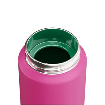 Pink water bottle with purple cap and green handle on a white background.