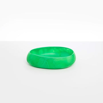 A medium sized shallow bowl made from green resin.