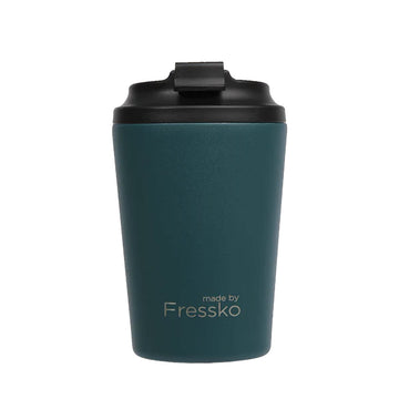 A reusable coffee cup in a dark emerald green with a black lid and the text 'made by Fressko' on the bottom.