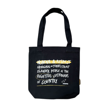 A black tote bag with the text 'Honour & Respect Aboriginal and Torres Strait Islander People as the Rightful Custodians of Country.' written in white.