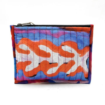 Colorful quilted pouch with abstract pattern on a white background.