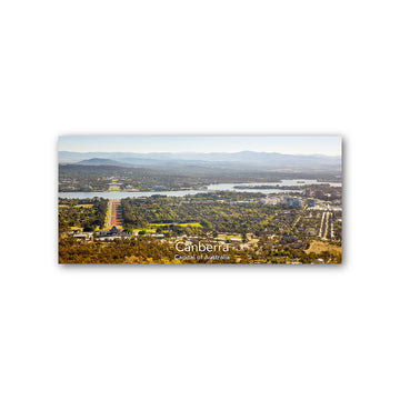 A rectangle magnet with a view of Canberra.