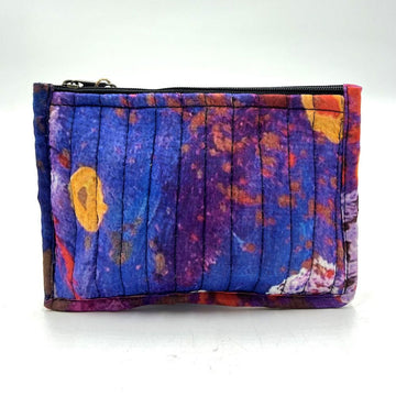 Colorful quilted pouch with a zipper on a white background.