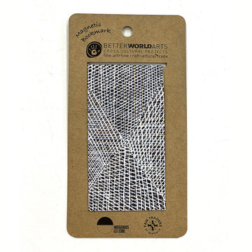 A magnetic bookmark printed with artwork by Paulina Puruntatmeri attached to a brown card.