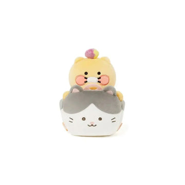 A bear shaped plush toy sitting in a cat shaped plush car.