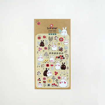 A sticker sheet filled with small stickers of bunnies and flowers.