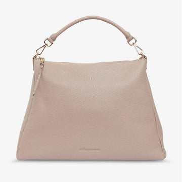 A fawn coloured bag with a matching short strap and zip along the top.