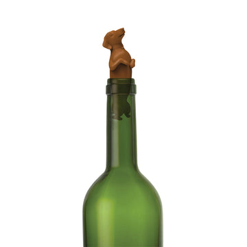 A box titled 'Winder Dog' with a picture of a dog shaped wine stopper in a wine bottle.