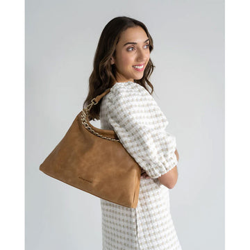 A tan bag with a matching short strap and zip along the top.