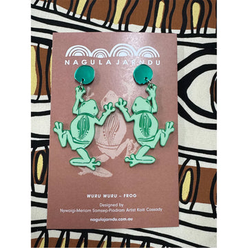 Frog earrings on a card with 'Nagula Jardu' branding against a patterned background.