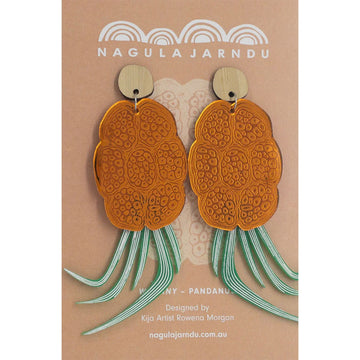 Nagula jarndu branded earrings with orange flowers and green leaves on a beige background.