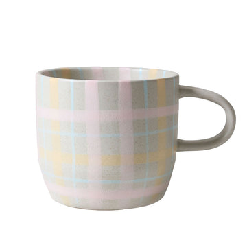 Mug with pastel plaid pattern on a white background.