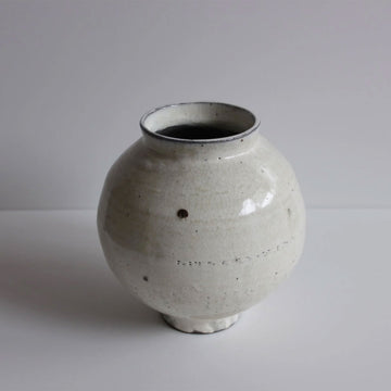 A small handmade stoneware vase.