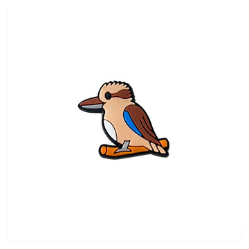 Cartoon kookaburra PVC shoe charm sitting on a branch with a white background.