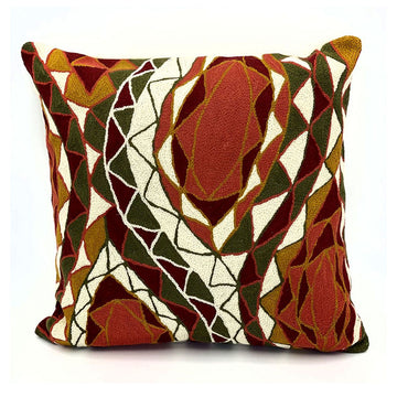Decorative pillow with geometric pattern on a white background.