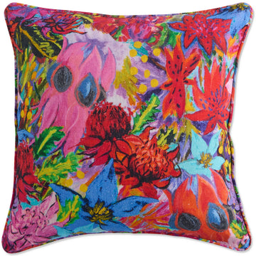 Front view of a square cushion printed with colourful abstract floral artwork.