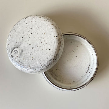 A ceramic handmade jewellery box in white stoneware.