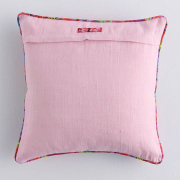 Front view of a square cushion printed with colourful abstract floral artwork.