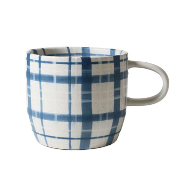 Mug with blue and white plaid pattern on a white background.