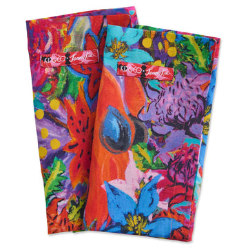 Two folded up fabric napkins printed with colourful abstract floral artwork.