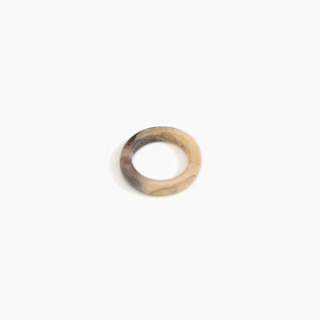 A round resin ring in light brown.