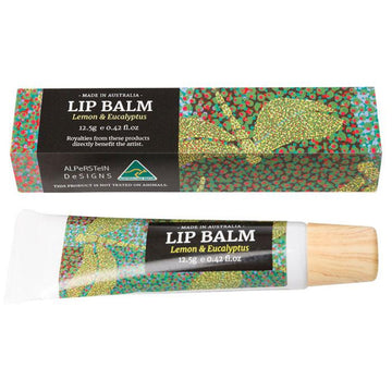 Lip balm tube with colorful packaging next to its matching box on a white background.