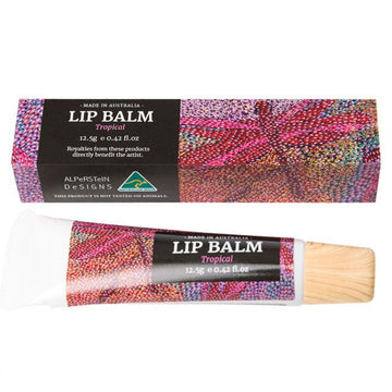 Lip balm tube with colorful packaging next to its matching box on a white background.