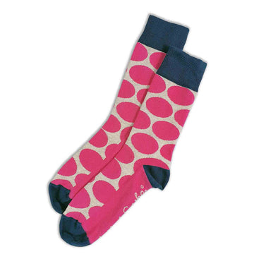 A pair of socks with a dark blue cuff, heel and toe and printed with pink spots.