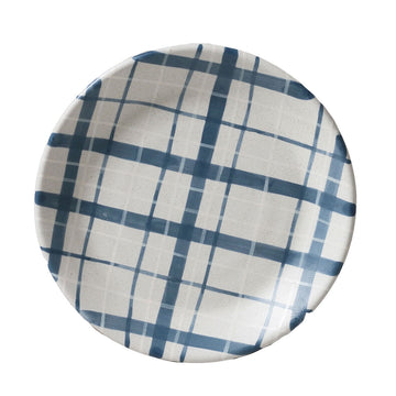 Round plate with blue and white checkered pattern on a white background.