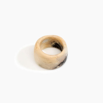 A resin ring in light brown with a wide band.