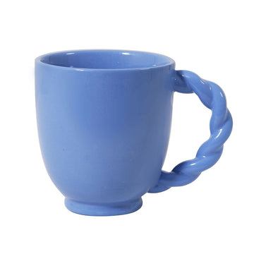 Blue mug with a twisted handle on a white background.