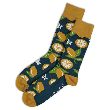A pair of dark blue socks printed with lemons both whole and halved.