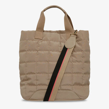 Front view of a tall quilted style bag with a striped strap diagonally across it in taupe.