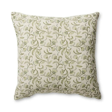 A square cushion illustrated with a repeating pattern of light green flower.