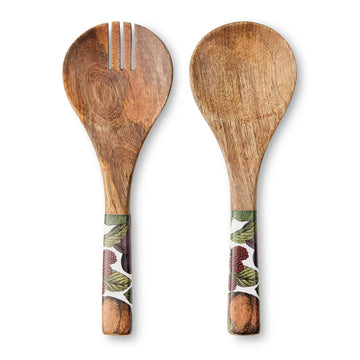 A pair of wooden salad servers with fruits and leaves printed on the handles.