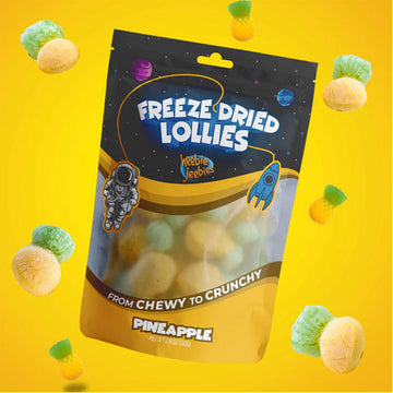 Package of freeze-dried lollies with pineapple flavor on a yellow background.